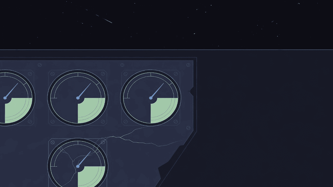 Close-up of analog dial gauges with needles sitting in the green zone, a thin crack creeping